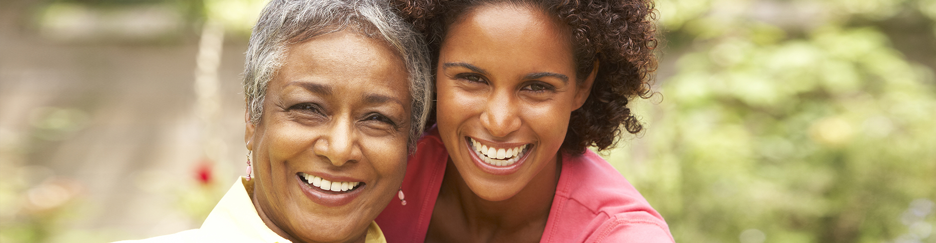 young lady and elder woman smiling