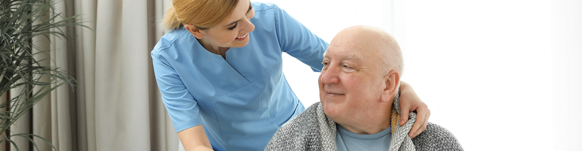 caretaker beside elder man